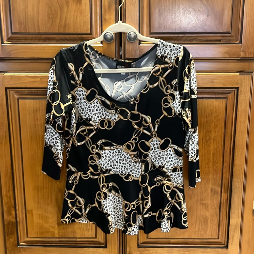 Equestrian/leopard 3/4 length sleeve peplum top.
